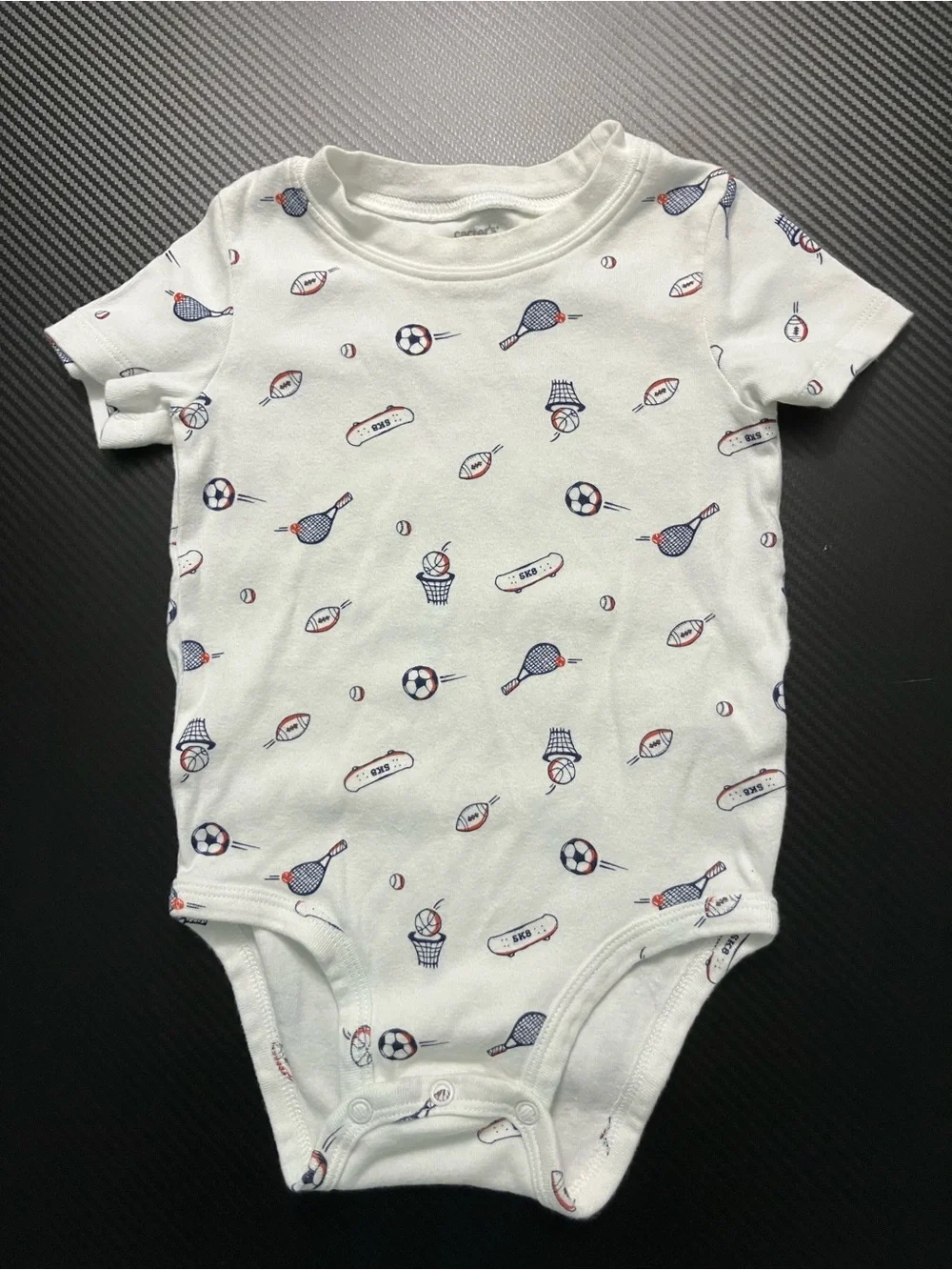 Carter's White Baby One-Piece with Navy and Red Sports Print
